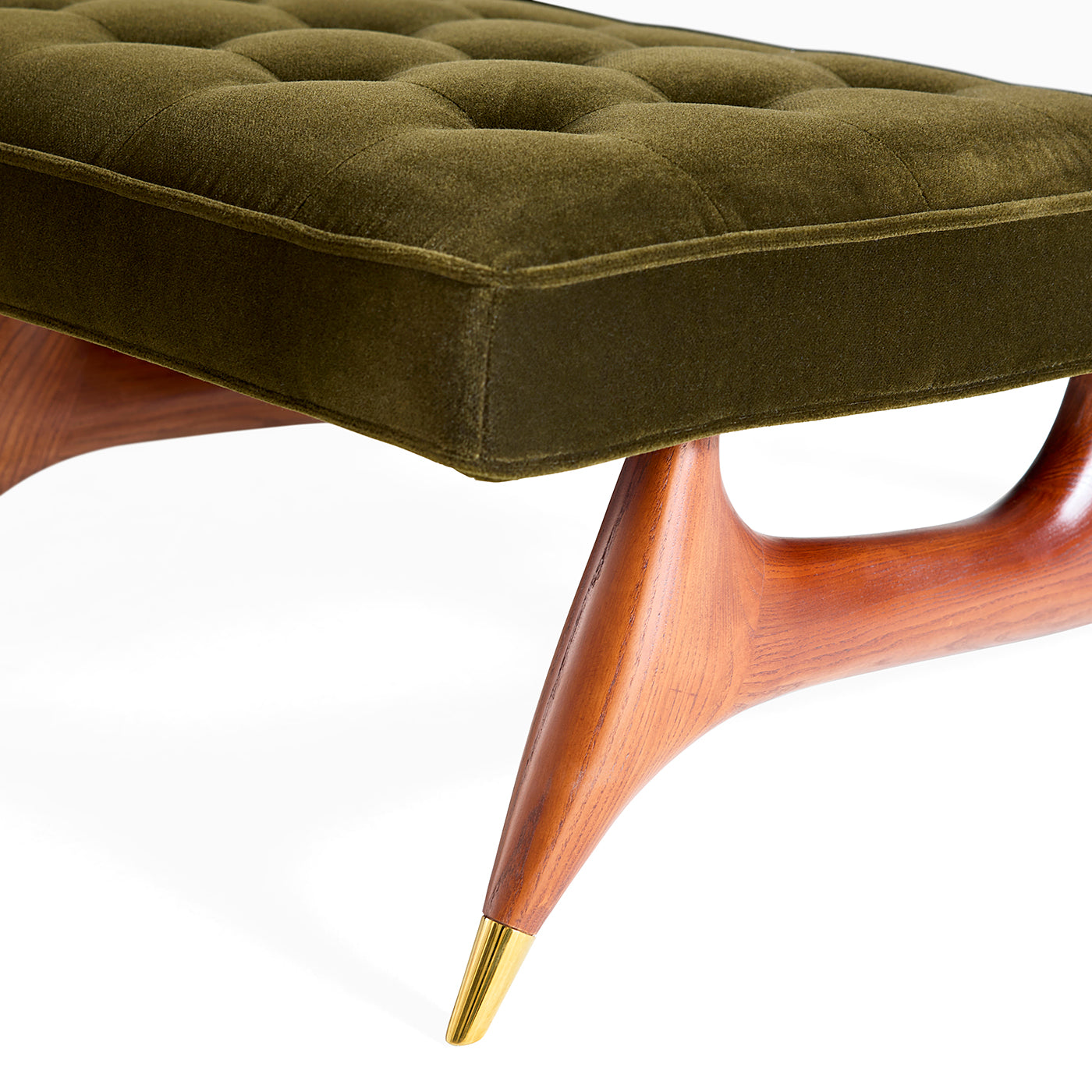 Green upholstered ottoman with wooden legs on a white background