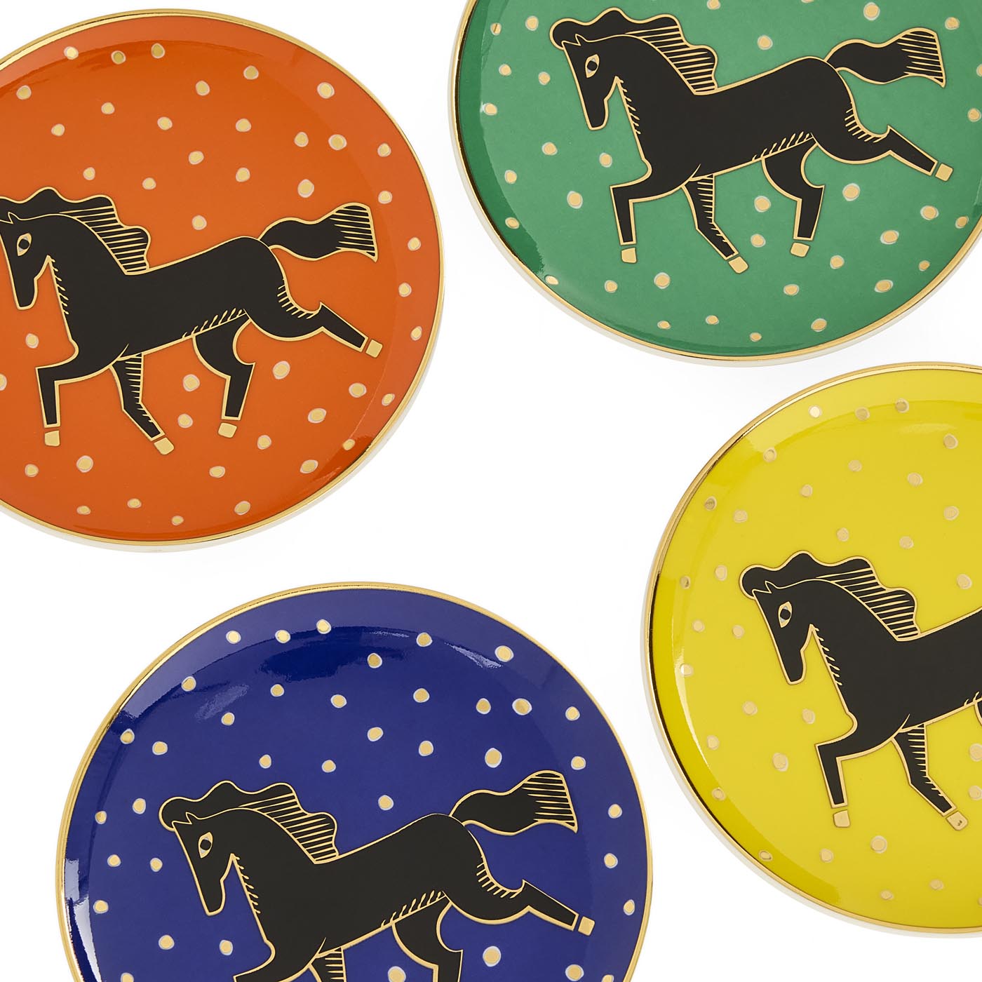 Four plates with black horse illustrations on polka dot backgrounds in orange, green, blue, and yellow.