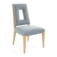 Chair with gray upholstered backrest and seat on a white background