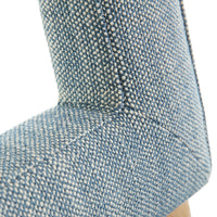 Close-up of a textured blue cushion on a white background
