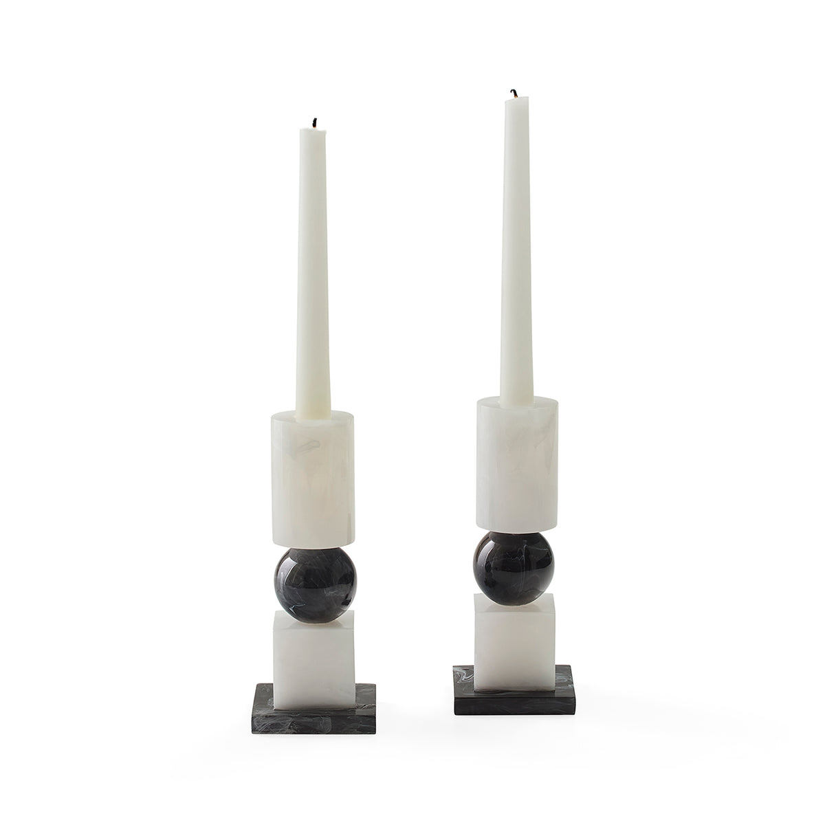 set of two black and white candle stick holders styled with white candlesticks (not included) 