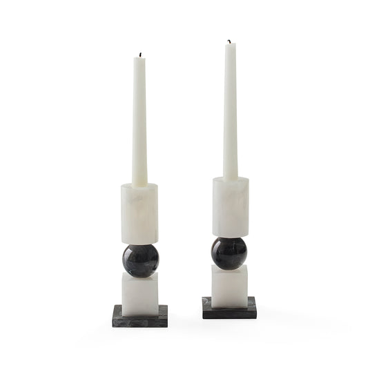 set of two black and white candle stick holders styled with white candlesticks (not included) 