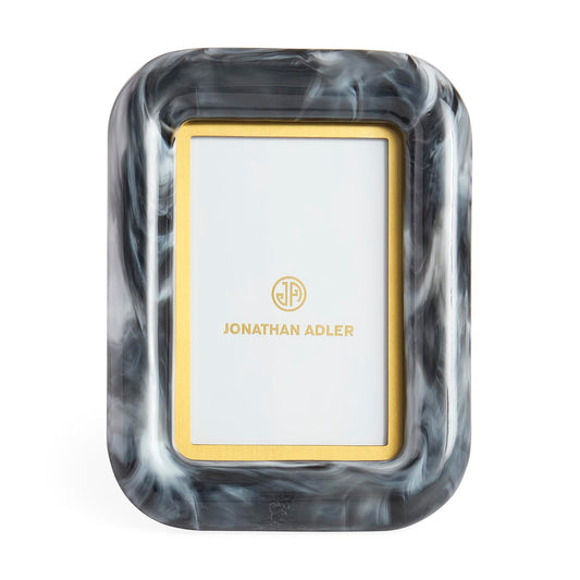 Marble-patterned picture frame with gold border and 'Jonathan Adler' logo on a white background