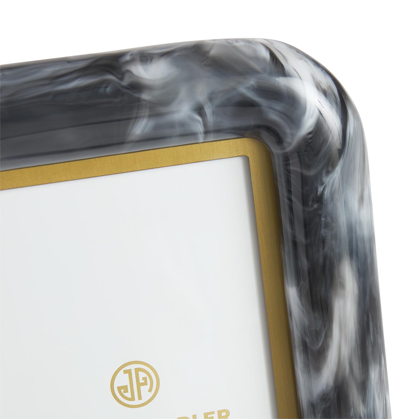 Close-up of a decorative frame with marbled design and gold accents.