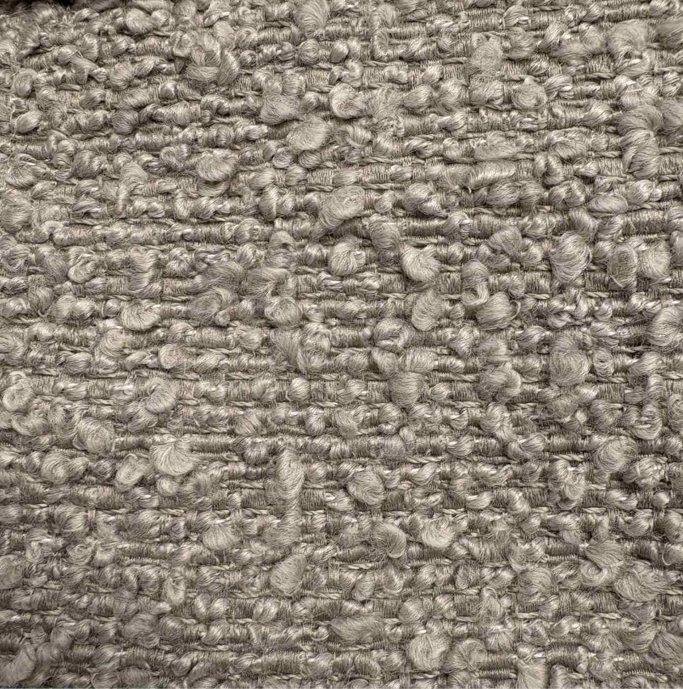 Close-up of a textured gray fabric surface