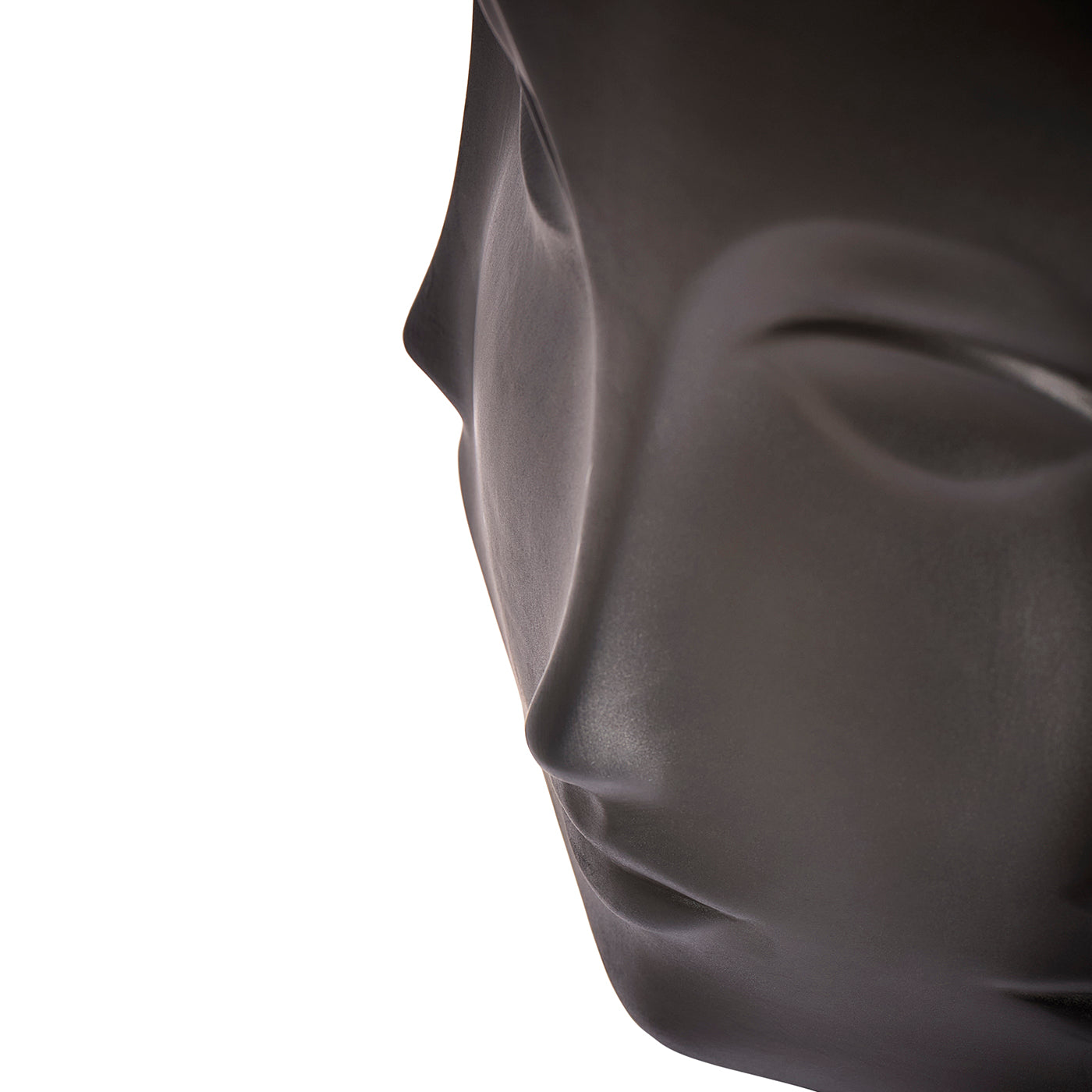 Close-up side profile of a matte black mannequin head on a plain white background.