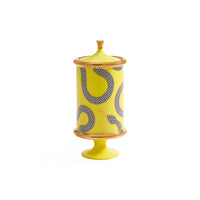 A yellow ceramic decorative jar with a matching lid, featuring a black and white checkered snake pattern and gold-toned trim, set against a plain white background.