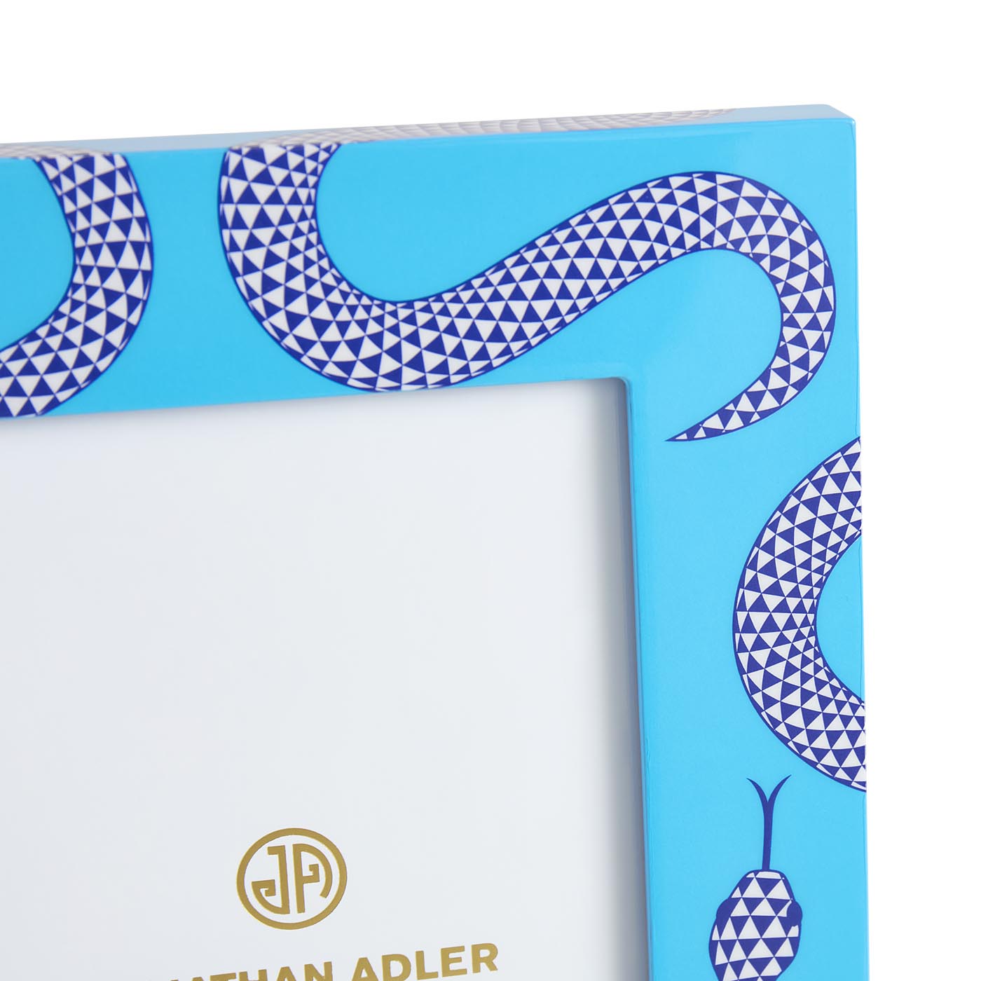 Blue decorative box with geometric pattern and Jothan Adler logo