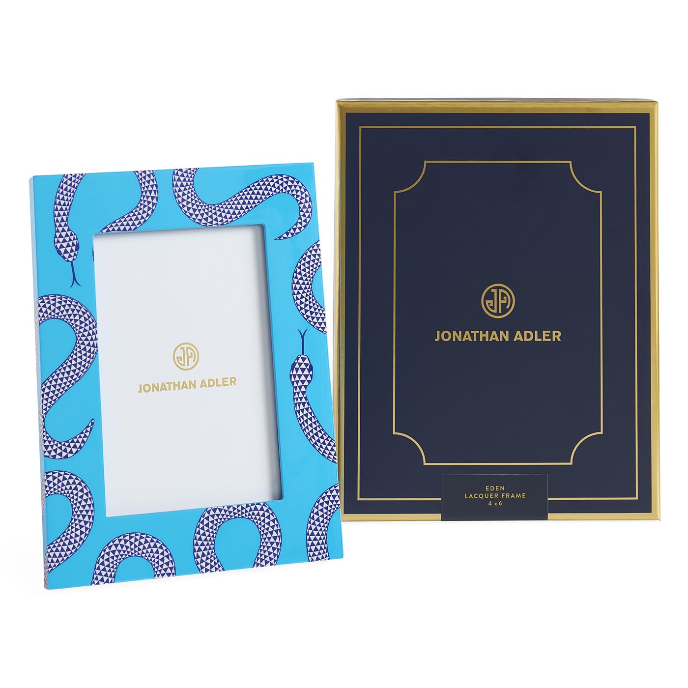Two Jonathan Adler picture frames, one blue with a snake pattern and the other navy with gold text, on a white background.