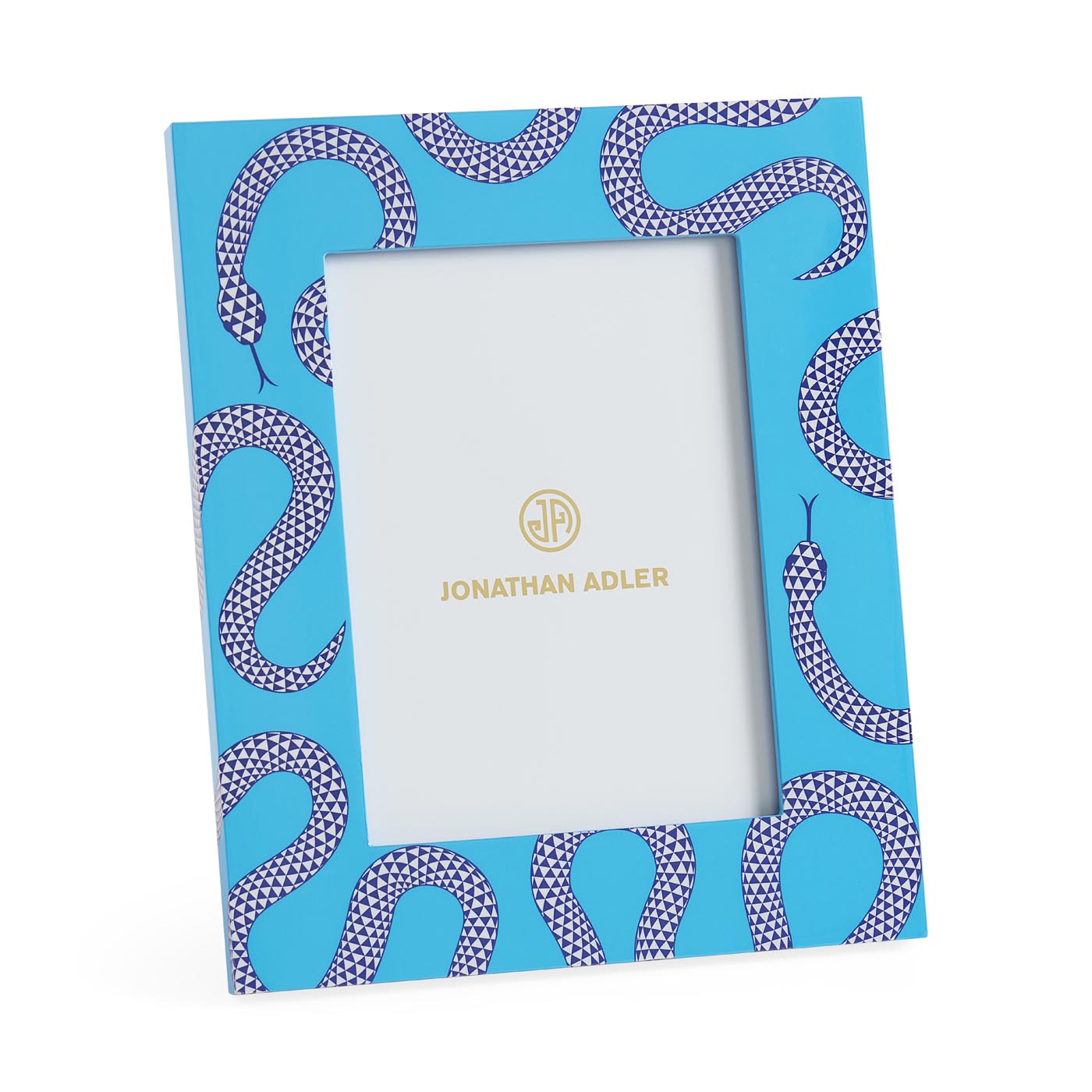 Notebook with snake pattern cover and white interior, Jonathan Adler branding visible