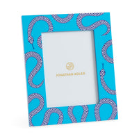 Notebook with snake pattern cover and white interior, Jonathan Adler branding visible