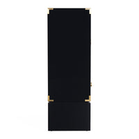 A tall, narrow black cabinet or storage unit with a rectangular base, featuring polished gold metal corner brackets and a small gold latch on the right side, shown against a plain white background.