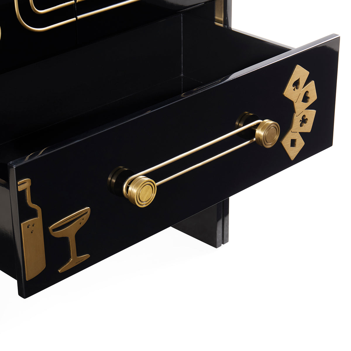 A close-up of a glossy black drawer with a gold bar-themed handle and gold decorative icons on the front, set against a clean white background.