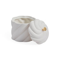 A white ceramic jar with a matching lid, featuring a sculpted spiral design and a small gold accent knob, shown on a clean white background.