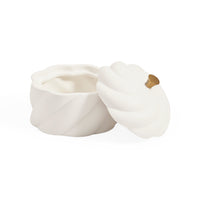 A white ceramic container with a matching lid, both featuring a twisted, sculptural design and a small gold accent knob, set against a plain white background.
