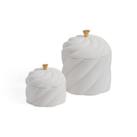 Two white ceramic canisters with a twisted spiral design and small gold-colored knob lids, shown on a plain white background.