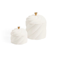 Two white ceramic lidded containers with a ribbed spiral design and small gold-toned knobs, shown on a clean white background.