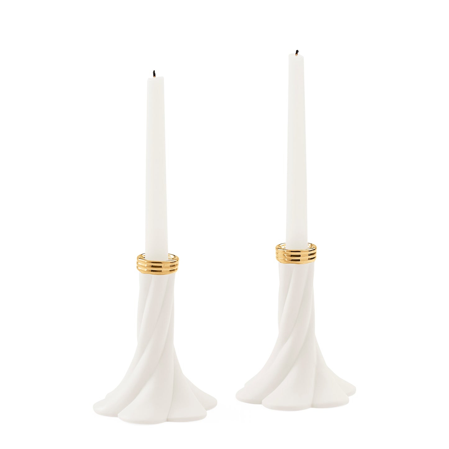 A pair of white taper candle holders with a flared, sculptural base and gold metallic bands near the top, shown on a plain white background.