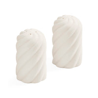 Two white ceramic salt and pepper shakers with a twisted spiral design, shown on a clean white background.