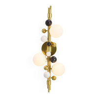 Modern wall sconce with gold fixture and glass globe shades on a white background
