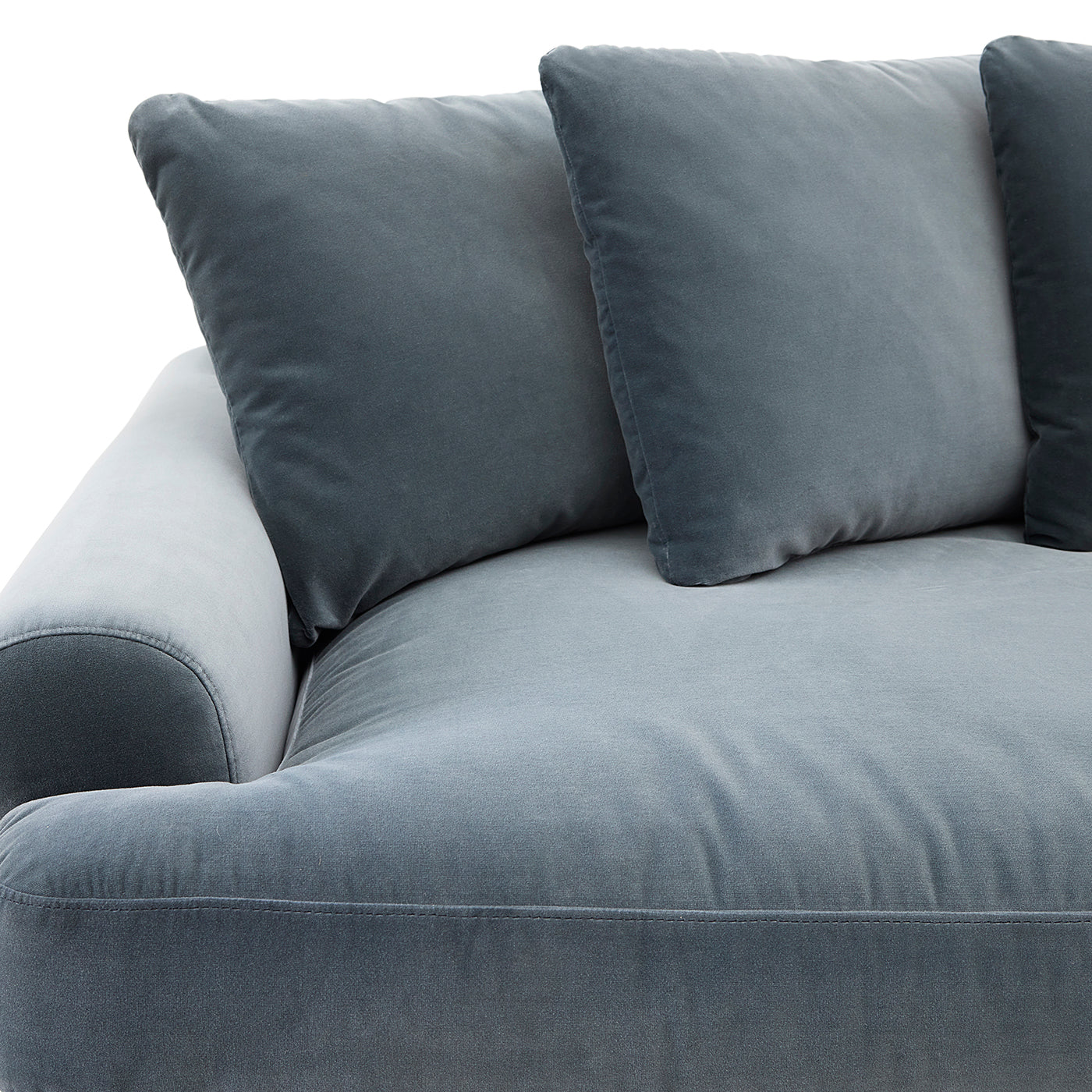 Gray sofa with three cushions on a white background