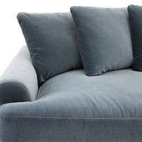 Gray sofa with three cushions on a white background