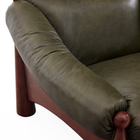Close-up of a green upholstered chair with wooden armrests on a white background