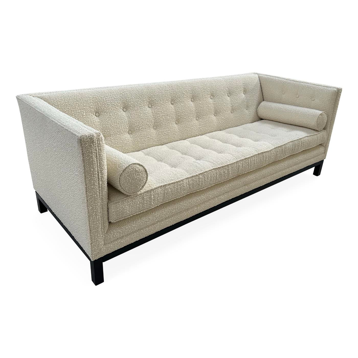 Beige tufted sofa on a white background