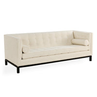 An off-white tufted loveseat sofa with a black metal frame and legs, shown from a three-quarter angle on a white background.