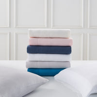 linen sheet set collection folded - styled view
