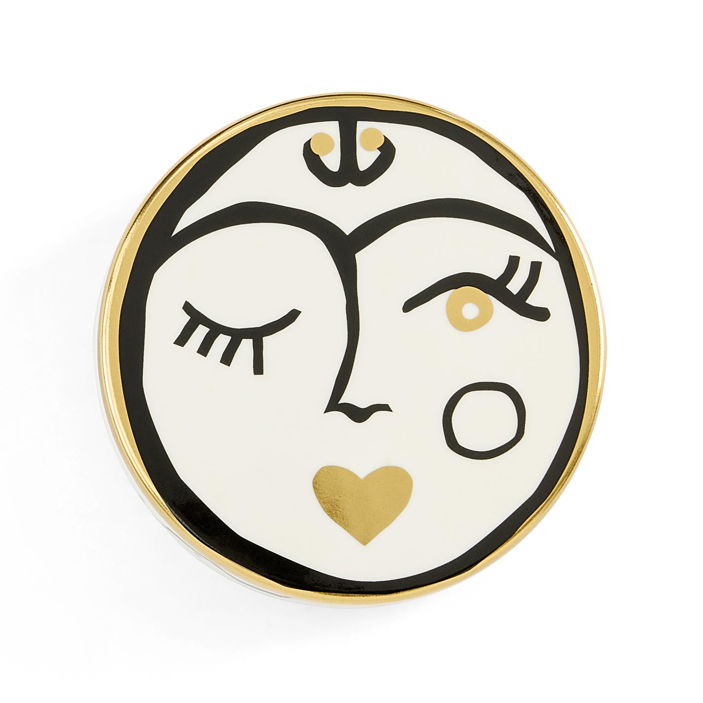 Decorative plate with a face design featuring a heart, on a white background