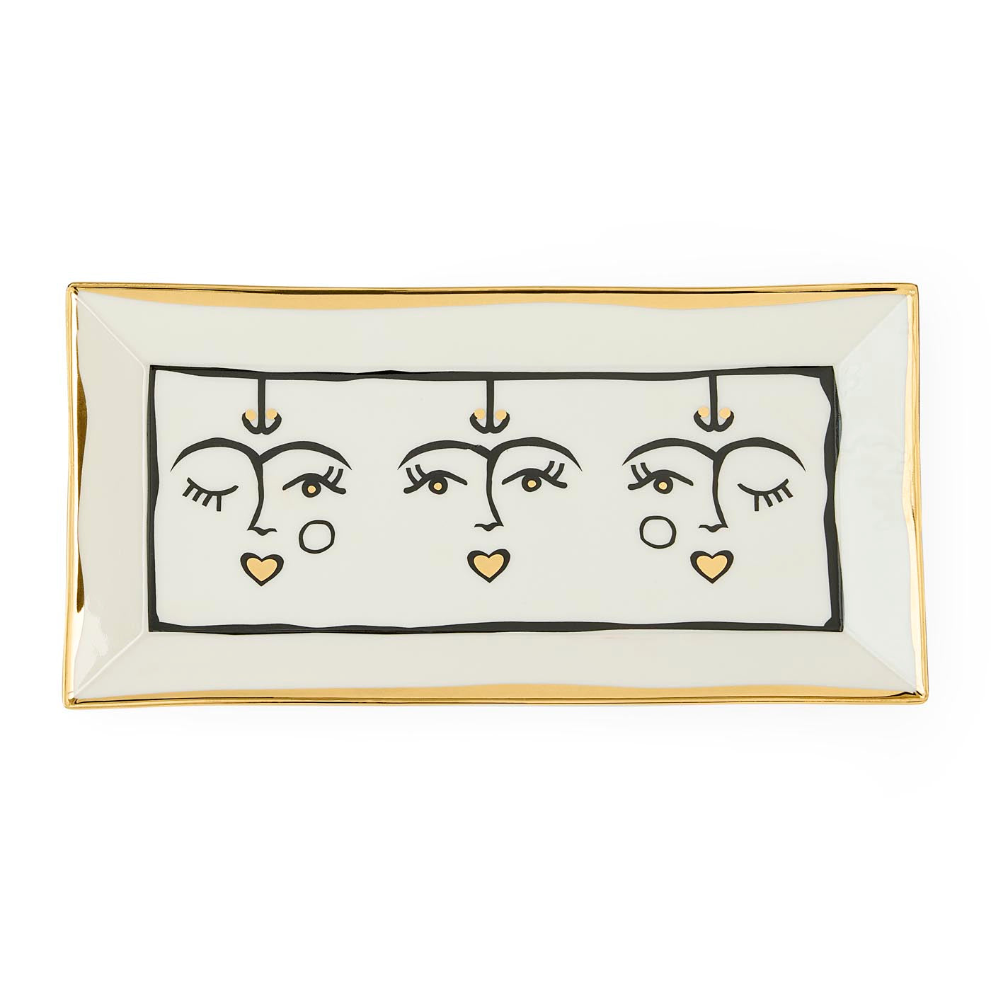 Rectangular ceramic tray with abstract face design on a white background