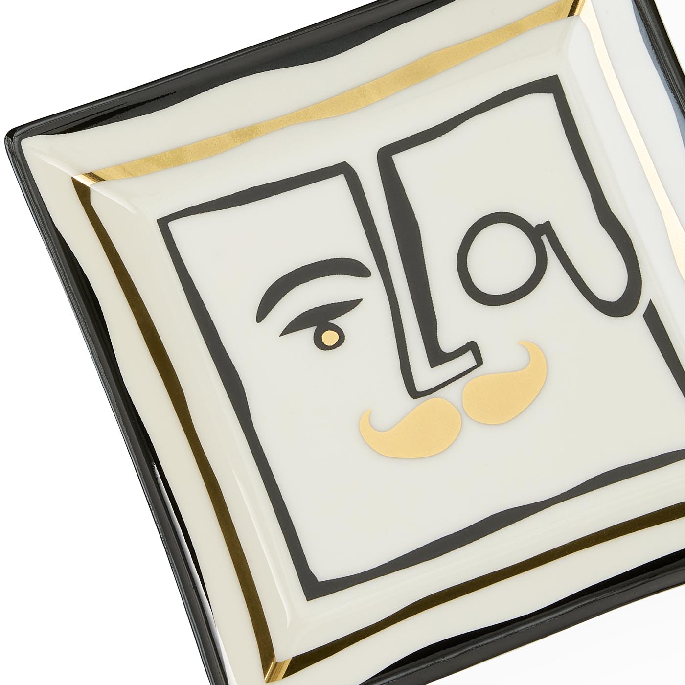 Decorative plate with artistic face design and 'Lou' text on a white background