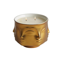 porcelain candle with gold exterior; two wick; face shaped  