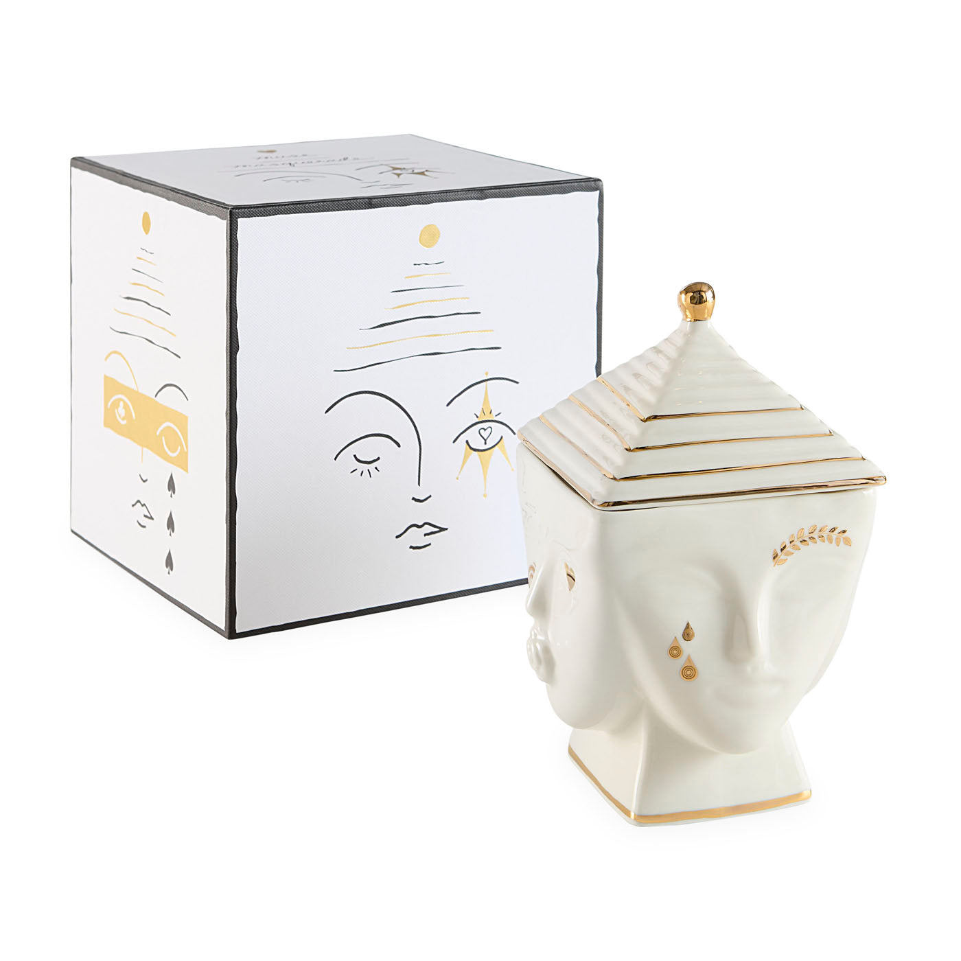 Decorative ceramic jar with face design next to its packaging box on a white background