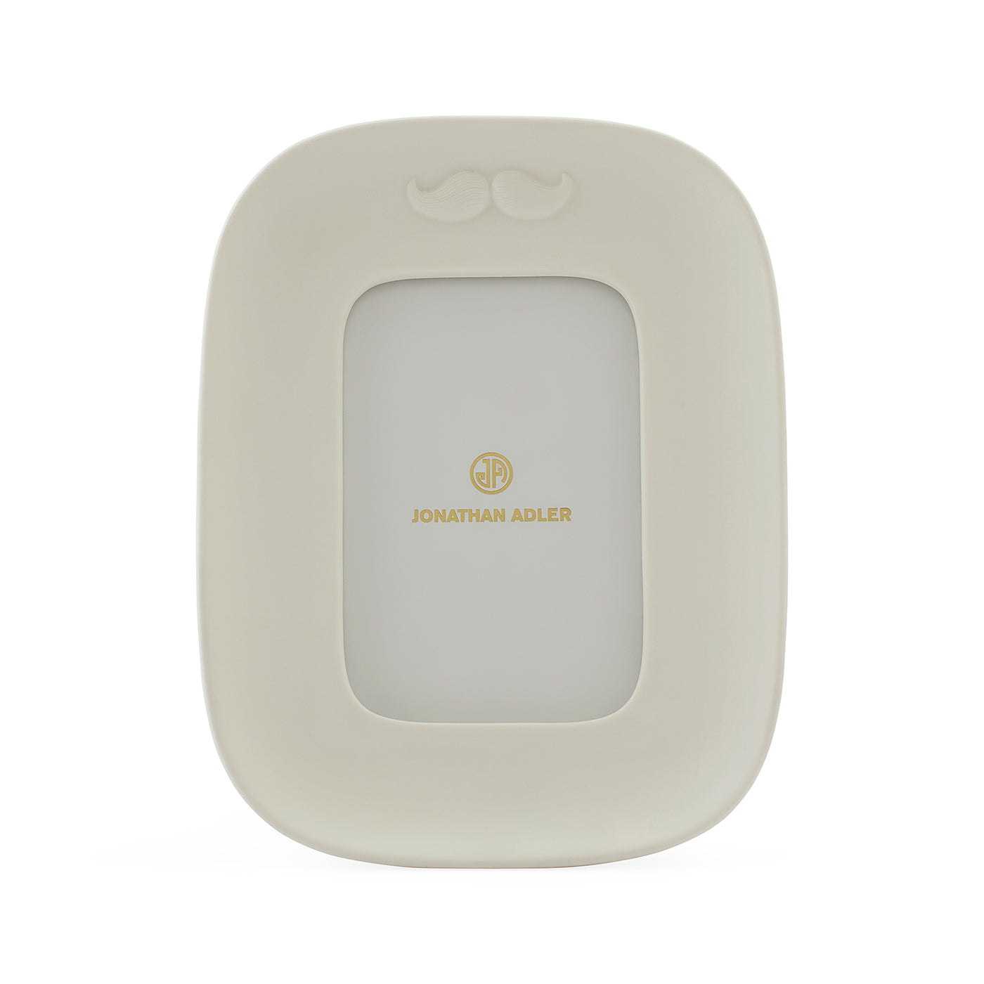 A cream-colored picture frame with a small mustache detail at the top and gold 'JONATHAN ADLER' branding in the center, shown on a plain white background.