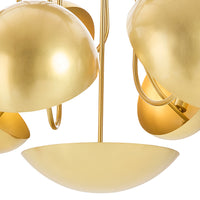 Close-up of a gold chandelier with multiple spherical lampshades.