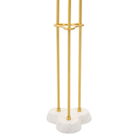 Gold umbrella stand with marble base on a white background