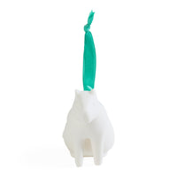 A white ceramic dog-shaped ornament with a bright teal green ribbon loop at the top, shown against a plain white background.