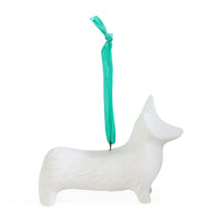 A white dog-shaped hanging ornament with a textured surface and a bright teal ribbon loop at the top, shown on a plain white background.