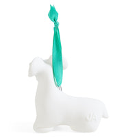 A white ceramic dog-shaped ornament with a bright teal green ribbon loop, shown on a clean white background.