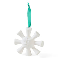 A white ceramic sun ornament with a green ribbon hanger, shown against a plain white background.