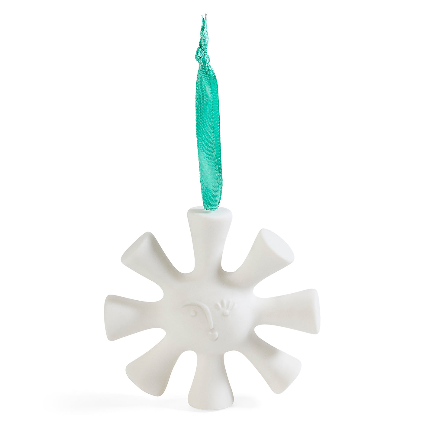 A white ceramic snowflake Christmas ornament with a small embossed face and a teal ribbon hanger, shown on a solid white background.