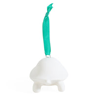 A white ceramic mushroom-shaped ornament with a small loop at the top holding a bright teal ribbon, shown against a plain white background.