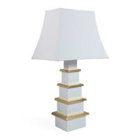 White table lamp with a gold base on a white background