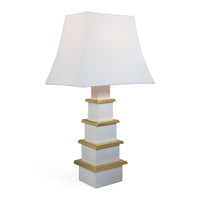 White table lamp with gold accents on a white background
