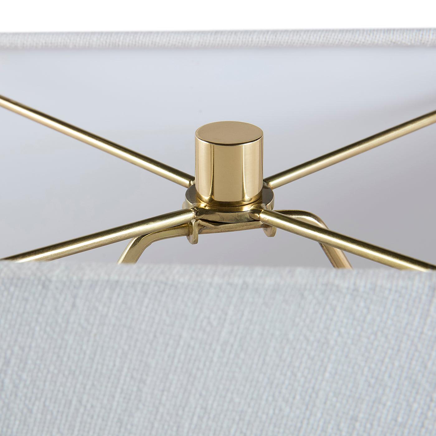 Close-up of a gold ceiling fan head on a white background