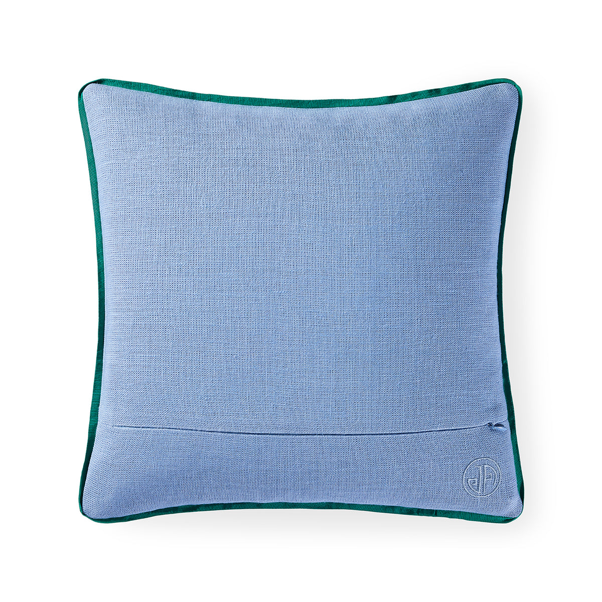 A square light blue textured throw pillow with a dark green velvet piped border, featuring a small circular embroidered monogram logo in the bottom right corner, set against a plain white background.