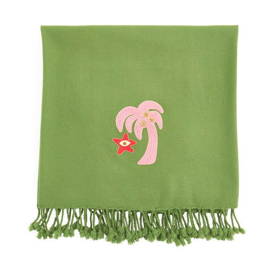 Green towel with pink palm tree and red starfish design on a white background