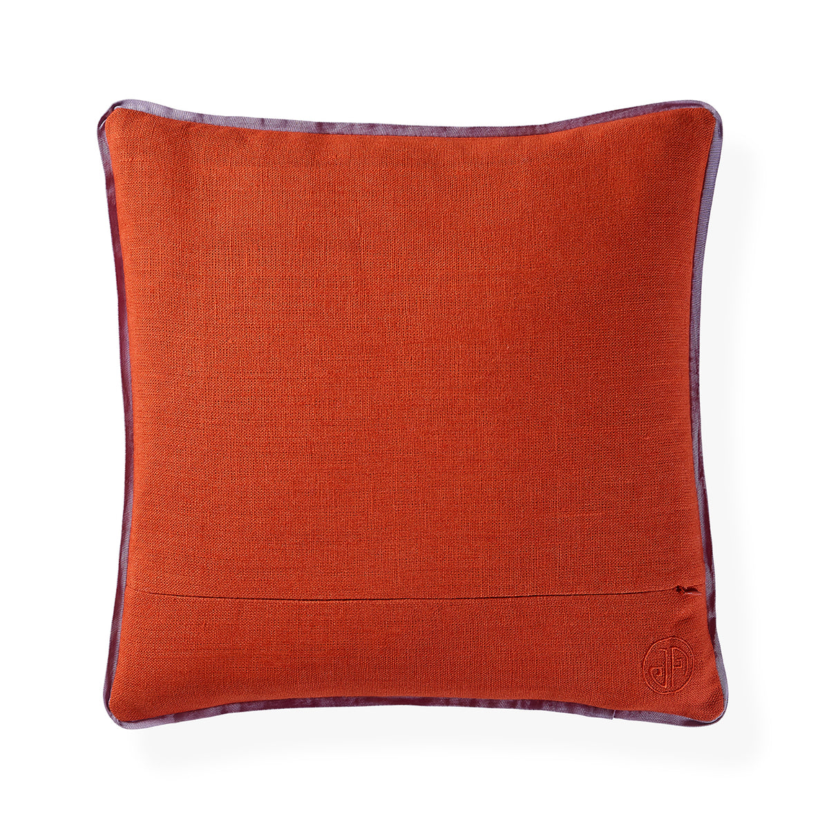 A square orange-brown textured throw pillow with a dark purple border trim and a small embroidered monogram logo in the bottom right corner, shown on a white background.